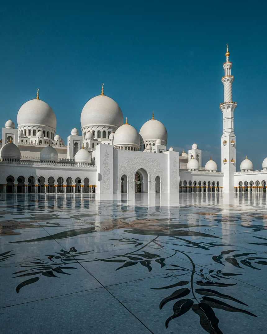 Sheikh Zayed Grand Mosque, a magnificent white marble structure in Abu Dhabi, with intricate domes and minarets.