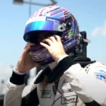 Will Power celebrating his podium finish at the Portland IndyCar race, showcasing his strategic victory.