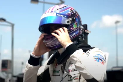 Will Power celebrating his podium finish at the Portland IndyCar race, showcasing his strategic victory.