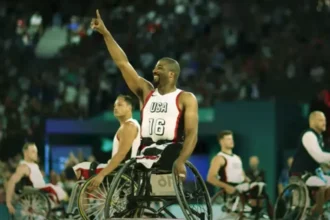 Wheelchair basketball players in action during a thrilling 2024 Paralympics match.