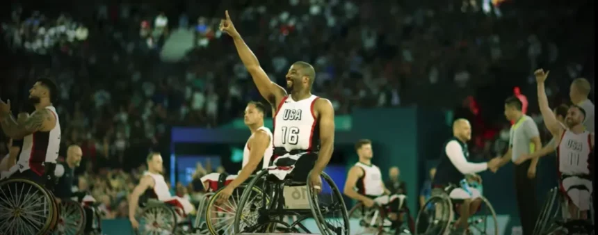 Wheelchair basketball players in action during a thrilling 2024 Paralympics match.