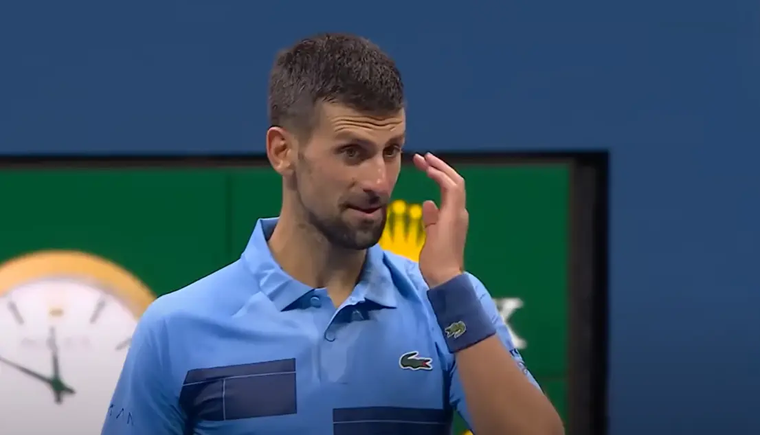 Novak Djokovic looks stunned on the court during his surprising defeat to Alexei Popyrin at the US Open.
