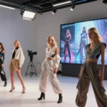 Fashion models in futuristic outfits in AI video production studio with Hypernatural AI screen display